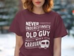 Maroon t-shirt featuring the text "Never underestimate an old guy with a caravan," with a caravan illustration.
