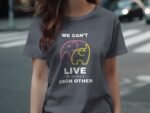A woman wearing a dark gray t-shirt with colorful elephant graphics and the text "We can't live without each other."