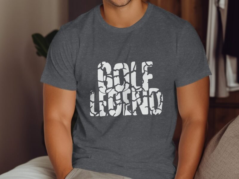 A man wearing a gray t-shirt with the words "GOLF LEGEND" printed in a bold, stylized font.
