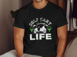 A close-up of a person wearing a black t-shirt with "GOLF CART LIFE" graphic and golf-themed icons.