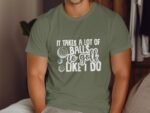 Man wearing an olive green t-shirt with the phrase "It takes a lot of balls to golf like I do" in white text.