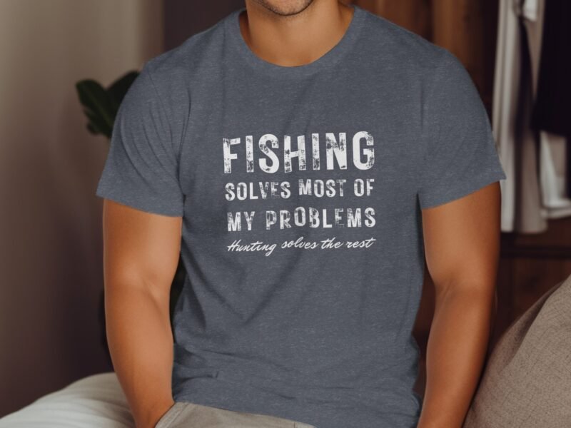 Man wearing a gray t-shirt with the text "Fishing solves most of my problems, hunting solves the rest."