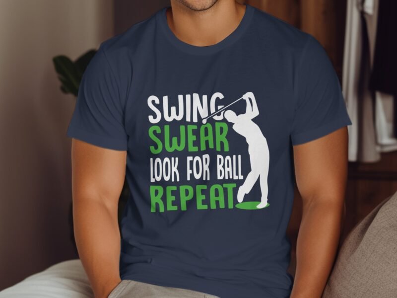 A person wearing a navy t-shirt with the text "SWING SWEAR LOOK FOR BALL REPEAT" and a golfer silhouette.