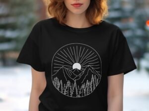 A woman wearing a black t-shirt featuring a white graphic of mountains and a sunburst design.