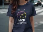 A woman in a navy t-shirt with a graphic of two elephants and the text "We can't live without each other."