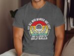 A man wearing a gray t-shirt with a golf-themed graphic and the text, "Not all who wander are lost, some are looking for Golf Balls."