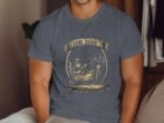 A man wearing a navy blue t-shirt features a "Gone Fishin'" graphic with a fisherman in a boat and trees.