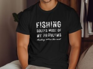 A person in a black t-shirt with text: "Fishing solves most of my problems. Hunting solves the rest."