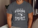 A man wearing a gray T-shirt with the text “Lucky Fishing Shirt Do Not Wash” and an illustration of a fish.