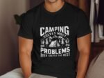 A person wearing a black t-shirt with a humorous camping graphic and text about problems and beer.