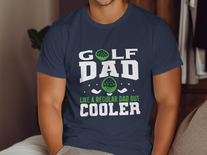 A man wearing a navy blue t-shirt with a humorous "Golf Dad" design, featuring golf balls and clubs.
