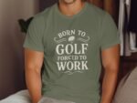 A man in a green t-shirt with the text "BORN TO GOLF FORCED TO WORK" sits casually in a cozy setting.