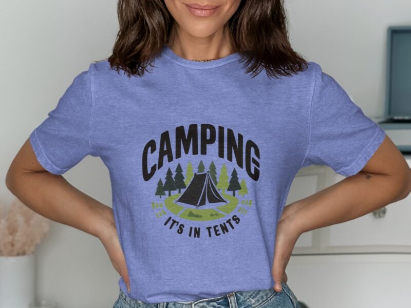 A woman wearing a purple t-shirt with "CAMPING IT'S IN TENTS" graphic, featuring a tent and trees design.