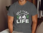 A man wears a gray t-shirt with "GOLF CART LIFE" graphic featuring a golf cart and golf tees in green and white.