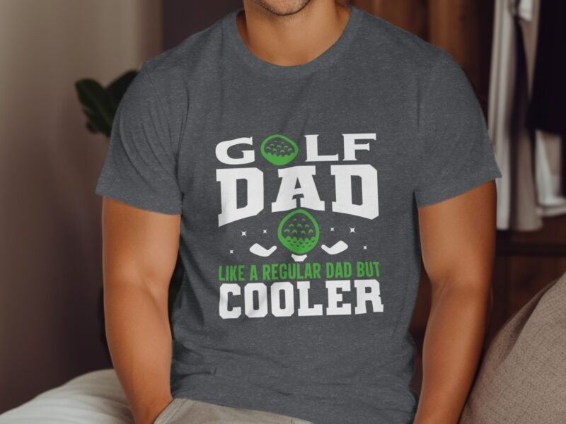 A man wearing a gray t-shirt with the text "GOLF DAD like a regular dad but cooler," featuring golf graphics.