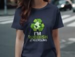 Woman wearing a navy t-shirt with a recycling symbol and the text "I'M RUBBISH AT RECYCLING."