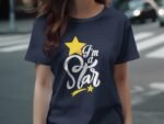 A woman wears a navy t-shirt featuring the text "I'm a Star" with a yellow star and decorative elements.