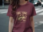 Woman wearing a maroon t-shirt displaying a vintage truck graphic with the text "Fuel for the Soul, Garage Built."