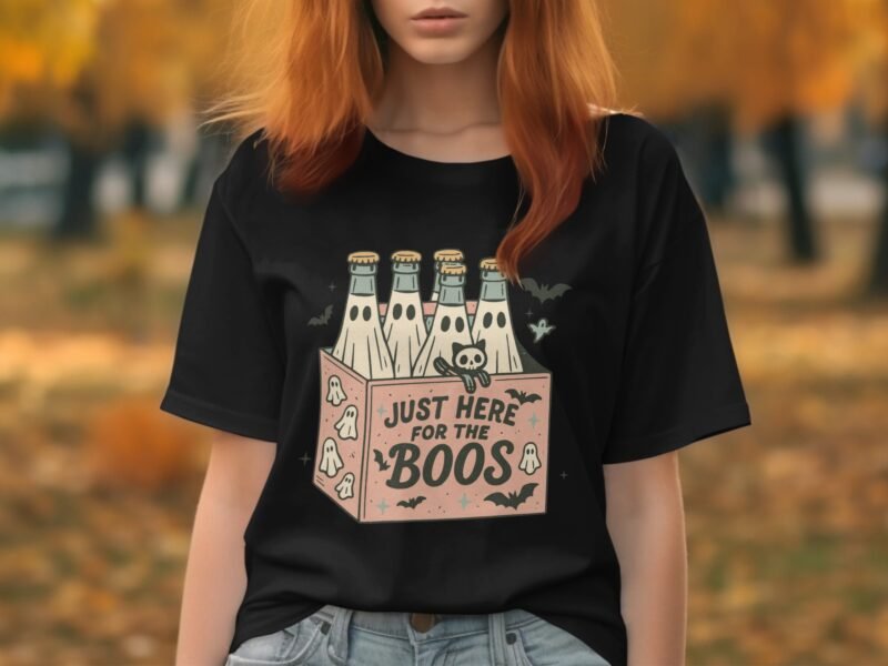 A woman with red hair wears a black t-shirt featuring a graphic of beer bottles and the text "Just Here for the Boos."