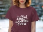 A woman wearing a maroon t-shirt with the text "CRAZY CAMPING CREW" and graphics of a tent and trees.