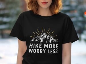 A person wearing a black t-shirt features a mountain graphic with the text "Hike More Worry Less" underneath.