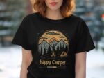 A woman in a black t-shirt with a camping design featuring mountains, trees, and the words "Happy Camper."