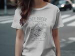 Woman wearing a light gray t-shirt with a vintage motorcycle graphic and the text "Cafe Racer, Live Young Die Free."