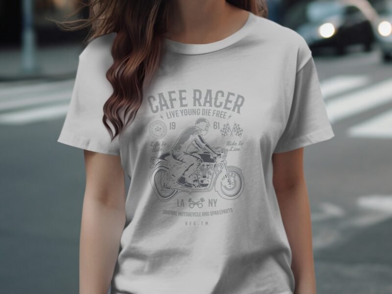 Woman wearing a light gray t-shirt with a vintage motorcycle graphic and the text "Cafe Racer, Live Young Die Free."