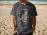 A man wearing a dark gray t-shirt featuring a motorcycle graphic and text about riding and bike racing.