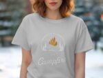 A person in a light gray t-shirt with a campfire design, text reads "Life is better around the Campfire."