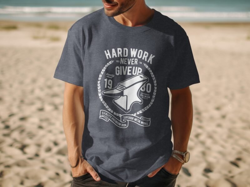 Man wearing a navy blue t-shirt with a graphic design featuring an anvil and the text "Hard Work Never Give Up."