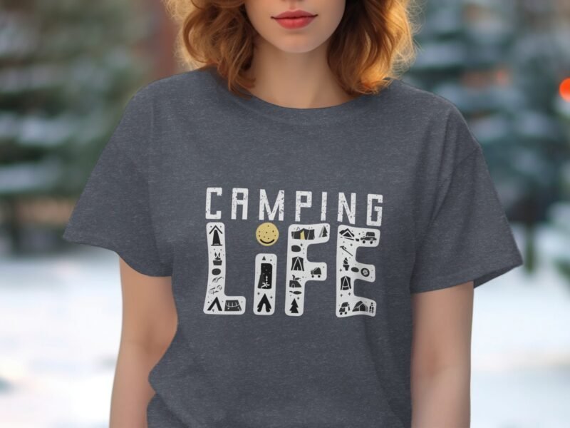 A woman in a gray t-shirt displays the text "CAMPING LIFE" decorated with camping icons in various colors.