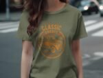 A woman in an olive-green t-shirt featuring a vintage truck graphic and text reading "Classic Garage."