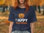 A woman wearing a navy blue Halloween-themed t-shirt with "Happy Halloween" and a carved pumpkin graphic.
