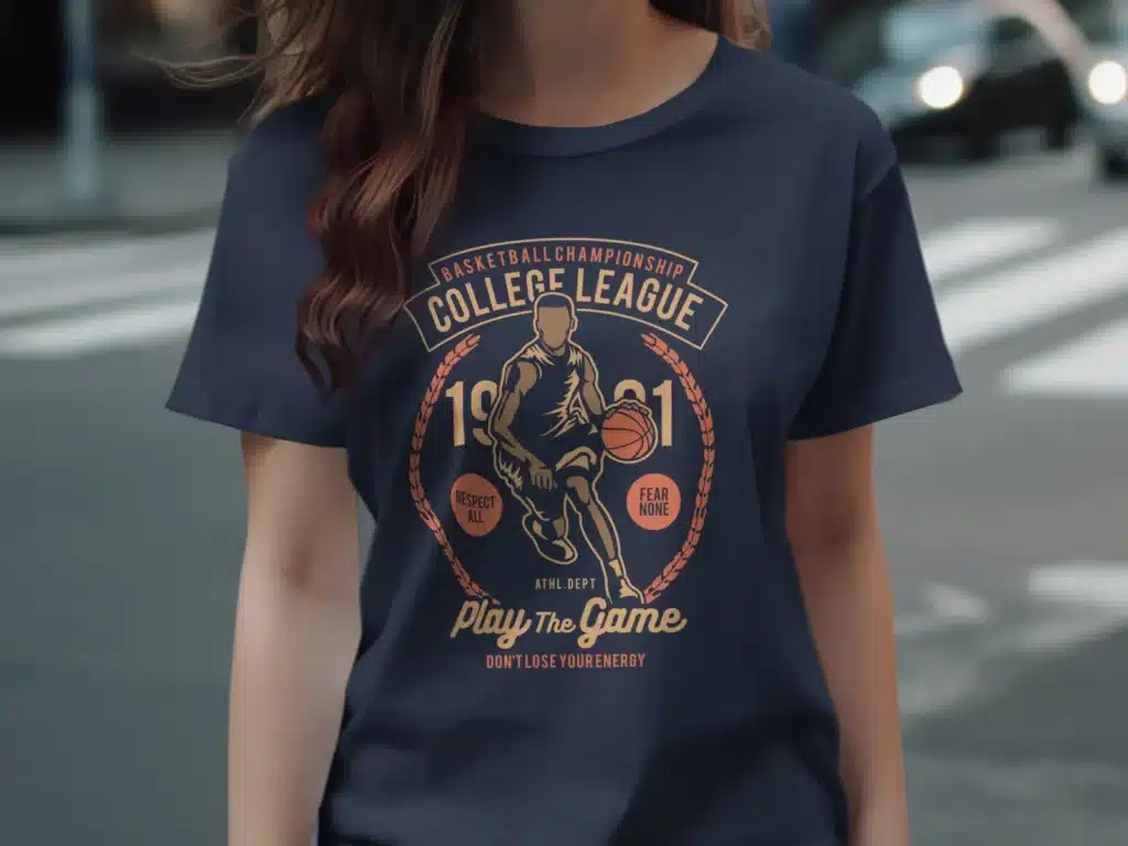 a stylist navy blue t-shirt with an image of a man dribbling a basketball