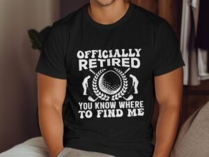 A man wears a black t-shirt with the text "Officially Retired" and golf-themed graphics.
