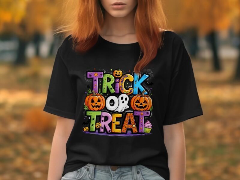 A woman in a black t-shirt with a colorful "Trick or Treat" design featuring pumpkins, a ghost, and candy.