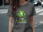 Woman wearing a gray t-shirt with a recycling logo and the text "I'M RUBBISH AT RECYCLING" on it.