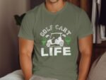 A person wearing a green t-shirt with "GOLF CART LIFE" text and graphic of a golf cart and golf balls.