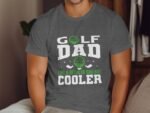Man wearing a gray t-shirt with "GOLF DAD LIKE A REGULAR DAD BUT COOLER" printed in white and green.
