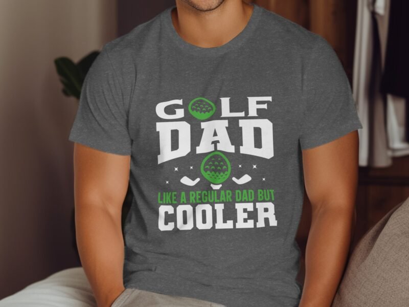 Man wearing a gray t-shirt with "GOLF DAD LIKE A REGULAR DAD BUT COOLER" printed in white and green.