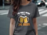 A person in a gray t-shirt with the text "I'm Only Here For THE BEER" and images of two beer mugs.