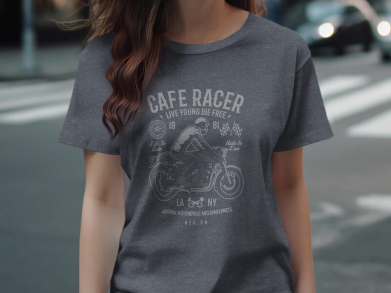 Woman wearing a gray t-shirt with a "Cafe Racer" motorcycle graphic and related text in a city setting.