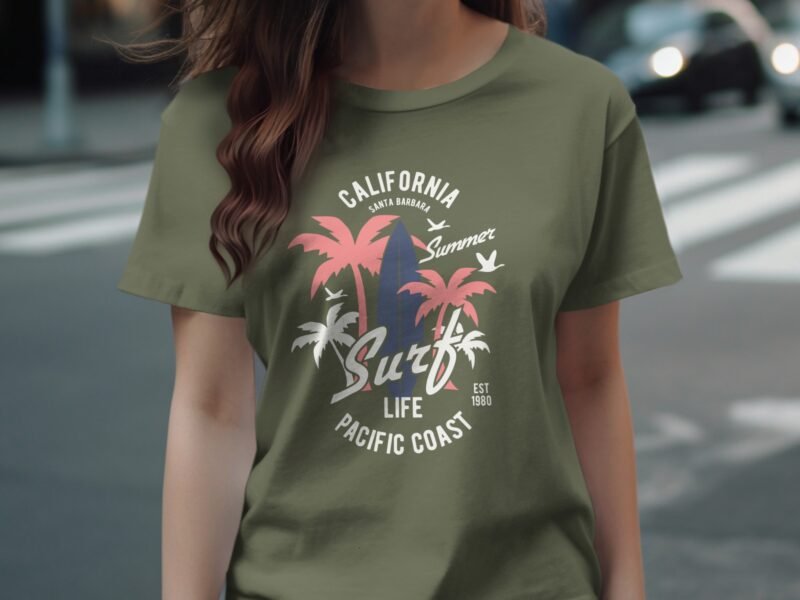 Olive green t-shirt with California surf graphics, featuring palm trees and the text "Surf Life Pacific Coast."