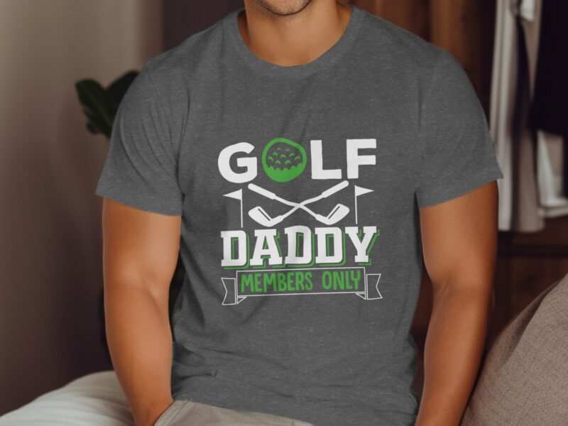 A man in a gray t-shirt with the text "GOLF DADDY MEMBERS ONLY," featuring golf-themed graphics.