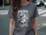 A person is wearing a gray t-shirt featuring the text "Hard Work Never Give Up" and an anvil graphic.