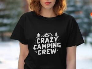 A woman wearing a black t-shirt with the text "CRAZY CAMPING CREW" and camping graphics, in a blurred outdoor setting.
