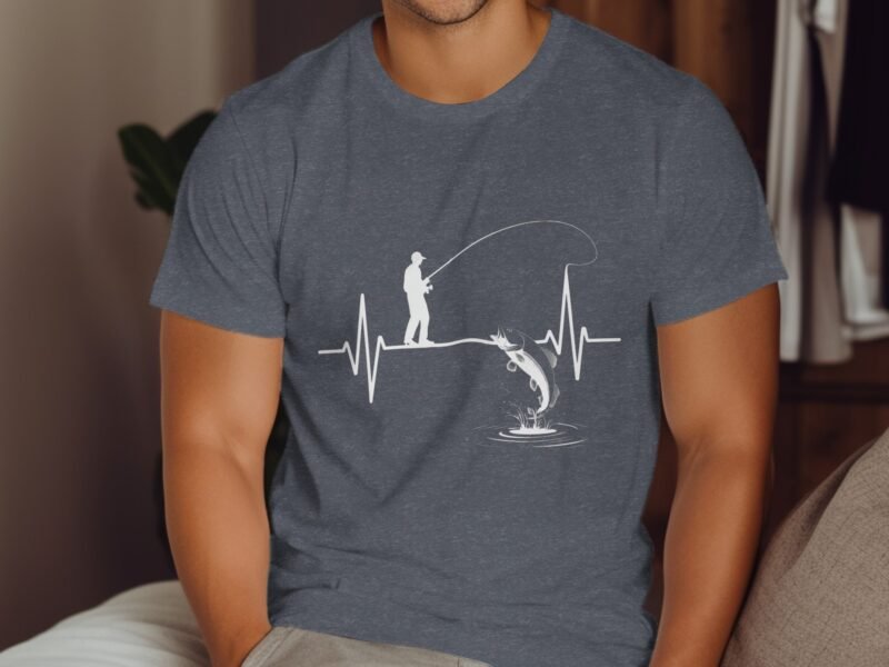 A man wearing a gray shirt with a white graphic of a fisherman catching a fish, framed by an EKG heartbeat line.