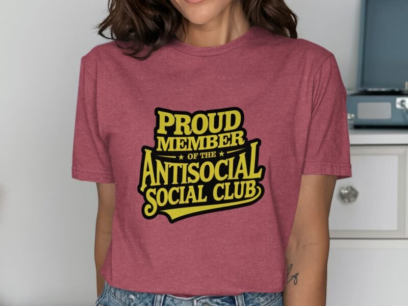 Person wearing a maroon t-shirt with yellow text reading "PROUD MEMBER OF THE ANTISOCIAL SOCIAL CLUB."