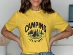 A woman models a yellow t-shirt with "CAMPING IT'S IN TENTS" and a graphic of a tent and trees.